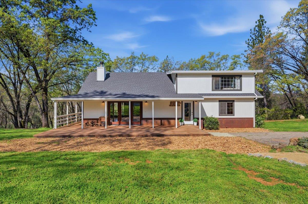11403 Woodacre Road Grass Valley, CA 95949 - Photo 1 of 69 a front view of a house with a yard