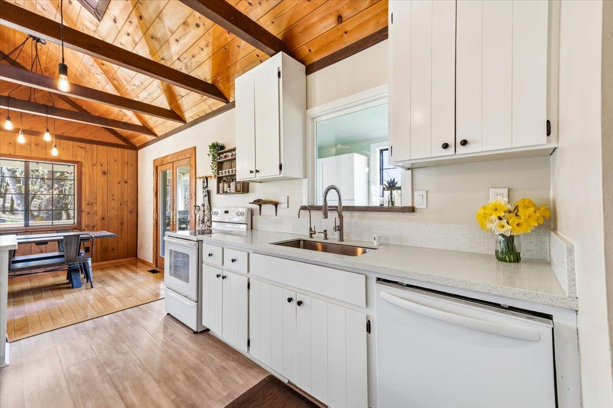 11403 Woodacre Road Grass Valley, CA 95949 - Photo 11 of 69 a kitchen with stainless steel appliances granite countertop a sink a stove and cabinets