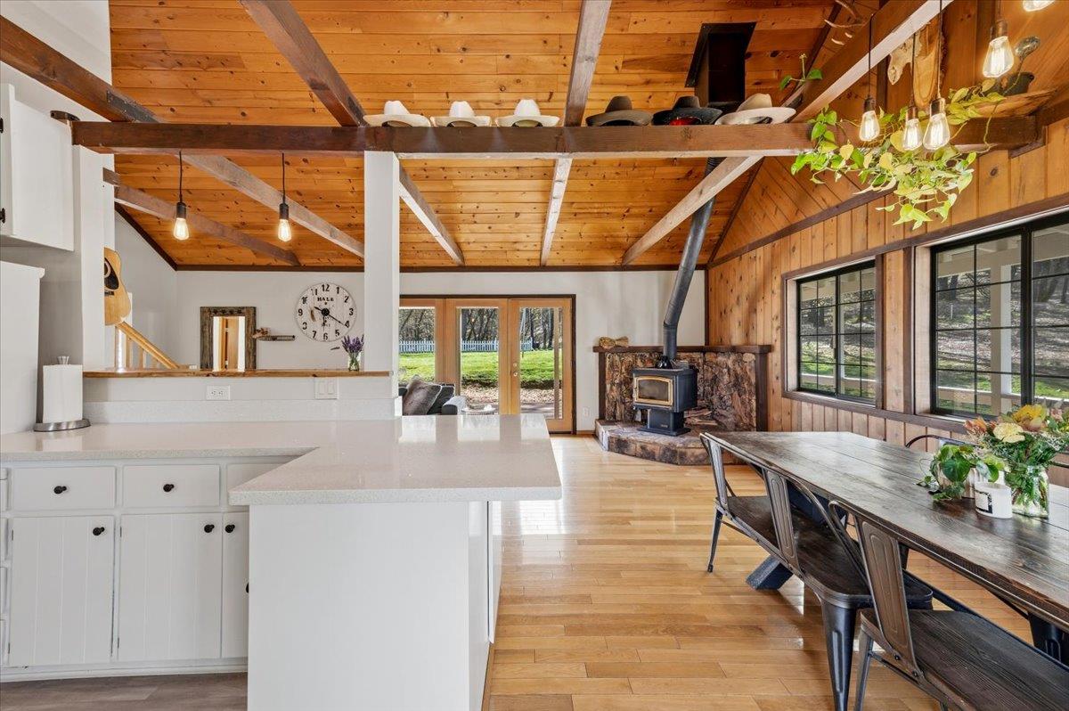 11403 Woodacre Road Grass Valley, CA 95949 - Photo 13 of 69 a dining room with wooden floor and outdoor seating