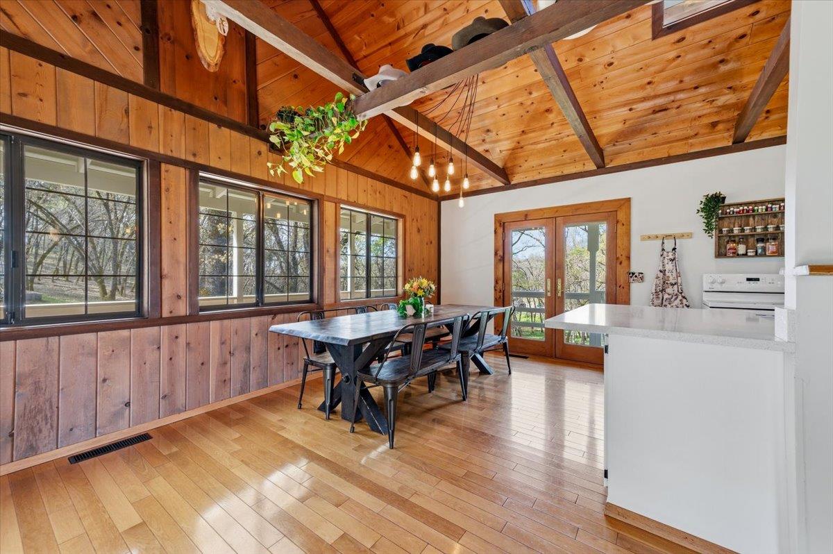 11403 Woodacre Road Grass Valley, CA 95949 - Photo 16 of 69 a view of a dining room with furniture window and wooden floor