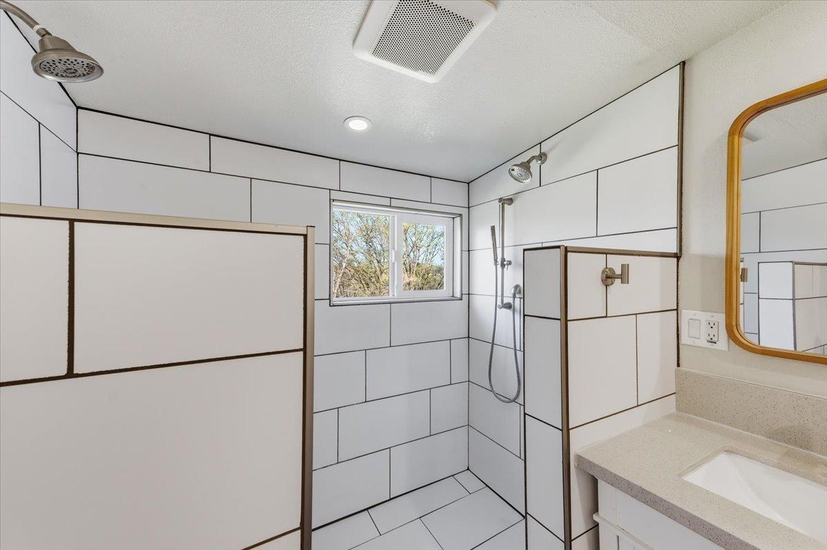 11403 Woodacre Road Grass Valley, CA 95949 - Photo 32 of 69 a white refrigerator freezer and a dishwasher sitting in a kitchen