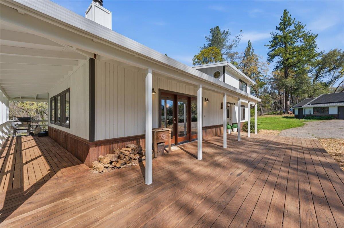 11403 Woodacre Road Grass Valley, CA 95949 - Photo 39 of 69 a view of a house with wooden floor and a barbeque