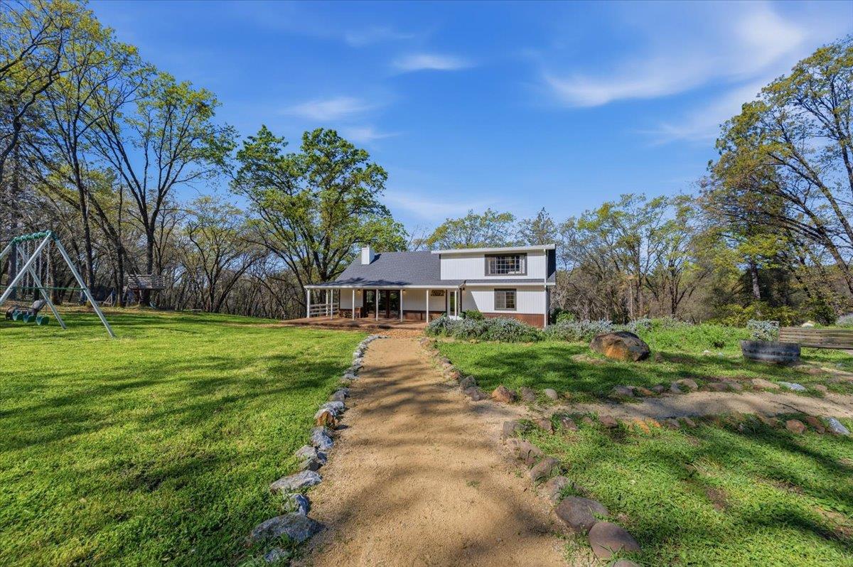 11403 Woodacre Road Grass Valley, CA 95949 - Photo 44 of 69 a view of a house with a yard