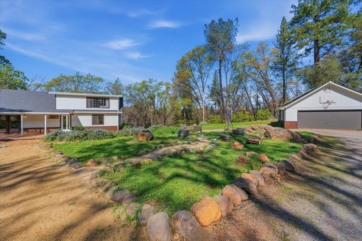 11403 Woodacre Road Grass Valley, CA 95949 - Photo 45 of 69 a front view of a house with a yard