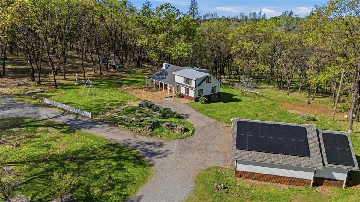 11403 Woodacre Road Grass Valley, CA 95949 - Photo 53 of 69 a view of a garden with lawn chairs