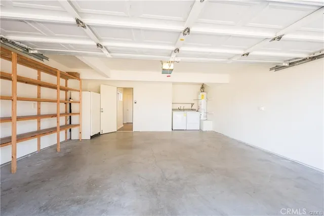 a view of backyard with wooden fence and large trees