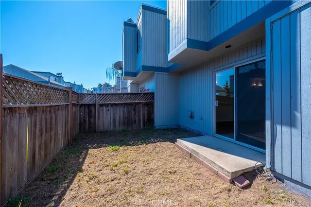 a view of a house with a yard and deck