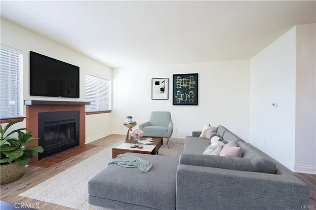 a living room with furniture a fireplace