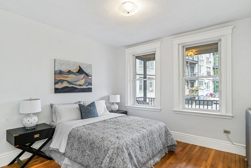 8 Kinross Road, Unit 4 Boston, MA 02135 - Photo 7 of 13 a bedroom with a bed and wooden floor