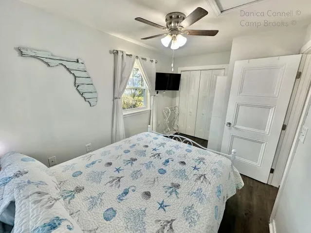 a bedroom with a bed and a bathroom