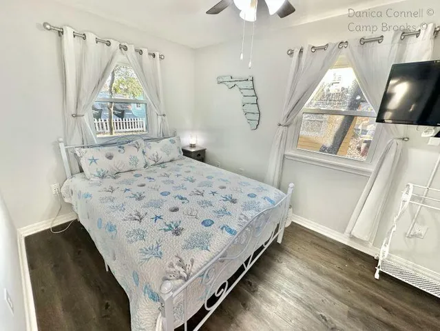 a bedroom with a bed and a window