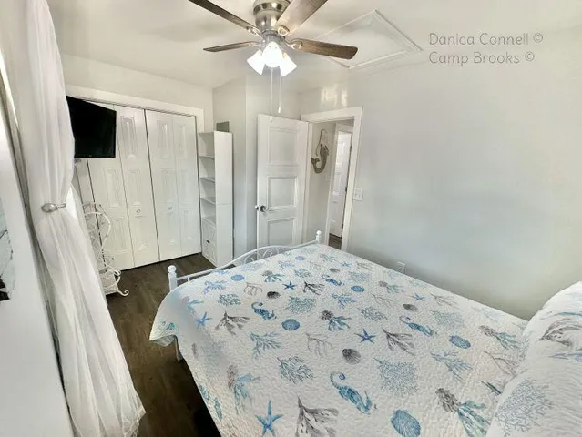 a bedroom with a bed and a bathroom