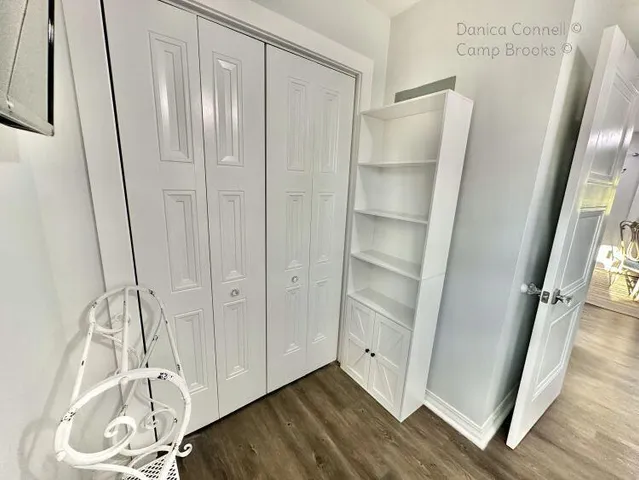 a view of walk in closet with empty racks
