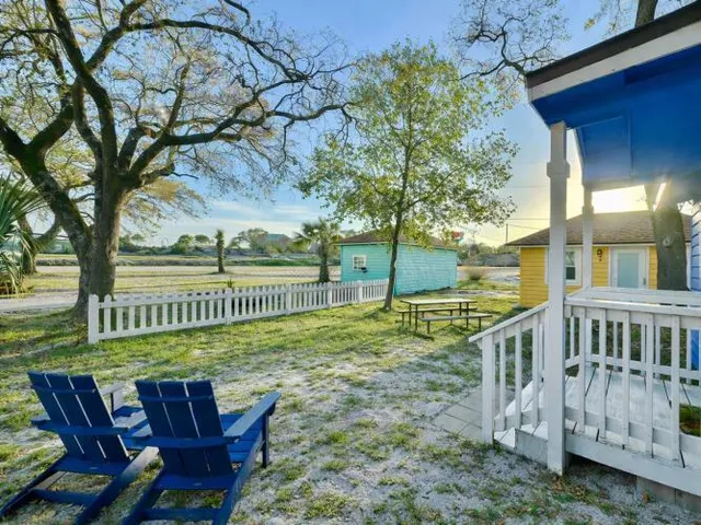 a view of a chair and table in the garden