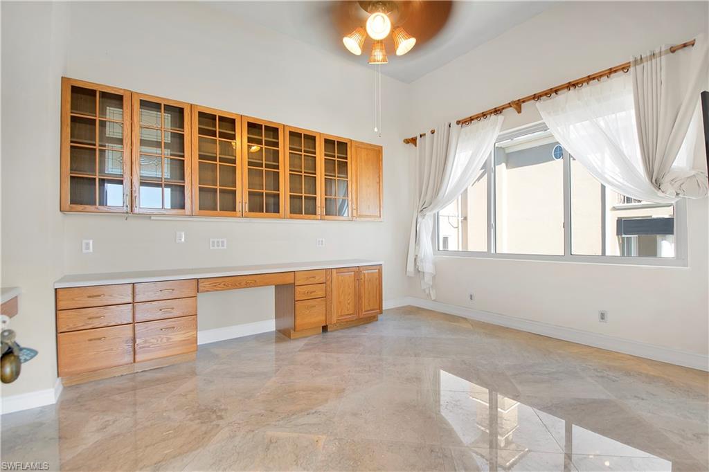 28 West Pelican Street Naples, FL 34113 - Photo 25 of 50 a view of an empty room with a window