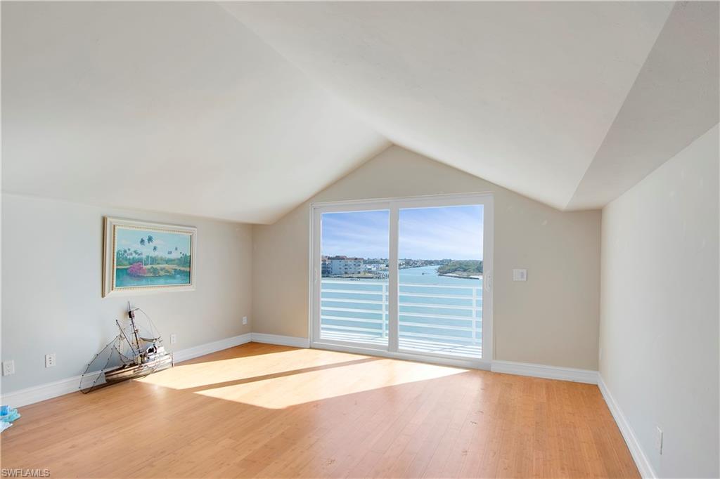 28 West Pelican Street Naples, FL 34113 - Photo 27 of 50 a bedroom with a bed and a window