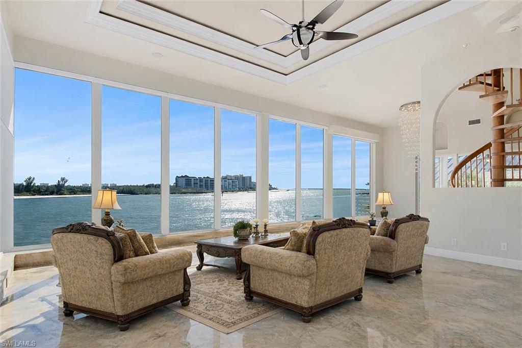 28 West Pelican Street Naples, FL 34113 - Photo 29 of 50 a living room with furniture and a large window
