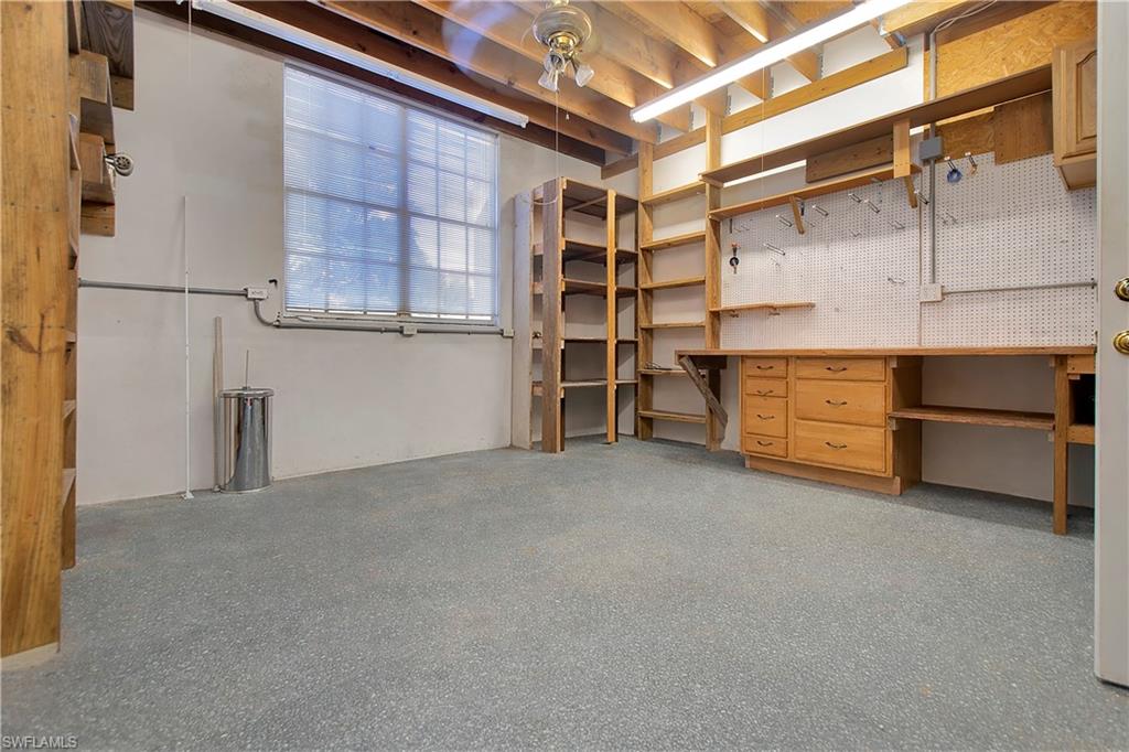 28 West Pelican Street Naples, FL 34113 - Photo 38 of 50 a view of an empty room with a cabinet