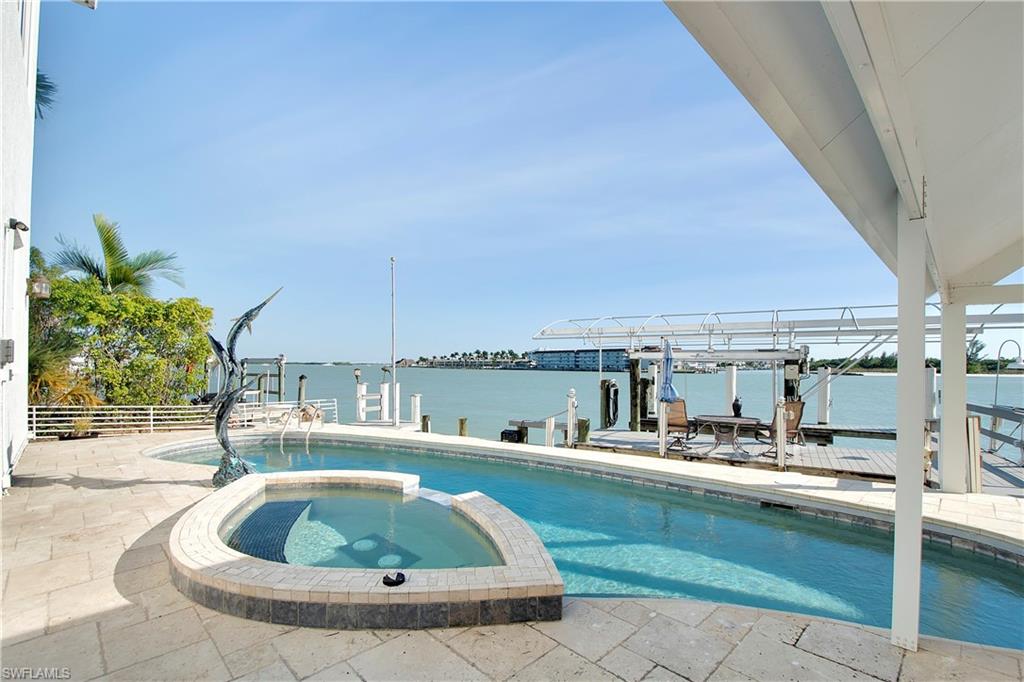 28 West Pelican Street Naples, FL 34113 - Photo 39 of 50 a house view with a outdoor space