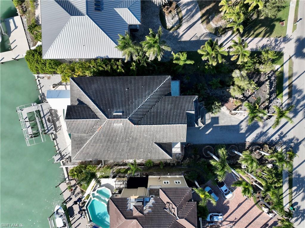 28 West Pelican Street Naples, FL 34113 - Photo 47 of 50 an aerial view of a house with a yard and garden