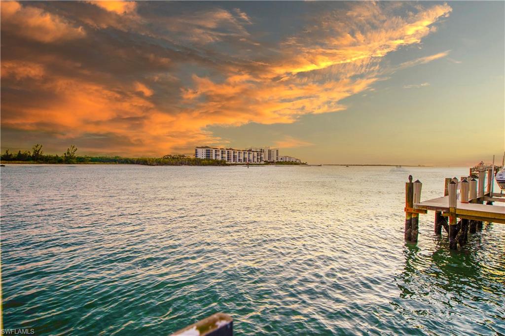 28 West Pelican Street Naples, FL 34113 - Photo 50 of 50 a view of an ocean from a balcony