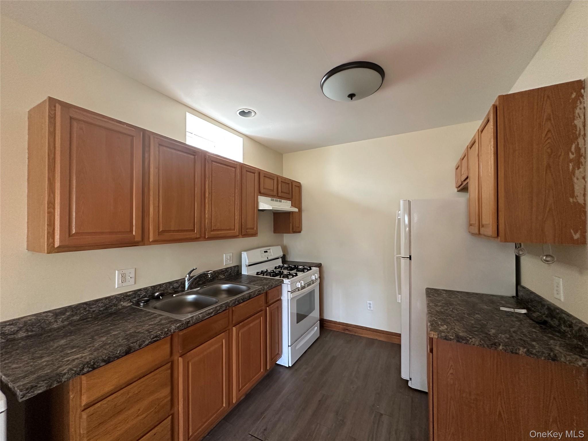 20 Bigelow Hall, Unit 1 Saugerties, NY 12453 - Photo 11 of 25 a kitchen with stainless steel appliances granite countertop a sink stove and refrigerator