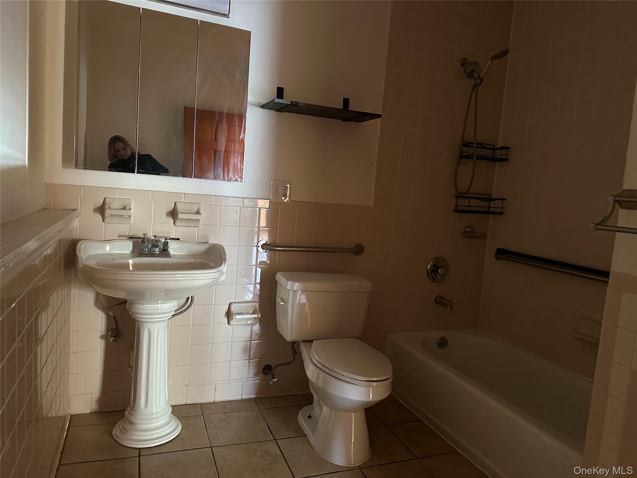 20 Bigelow Hall, Unit 1 Saugerties, NY 12453 - Photo 16 of 25 a bathroom with a sink toilet and shower