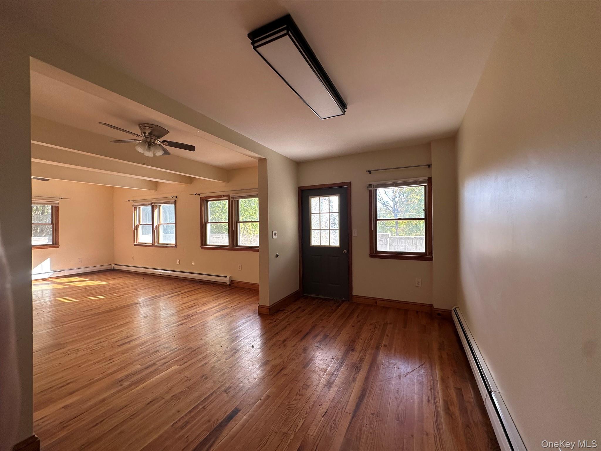 20 Bigelow Hall, Unit 1 Saugerties, NY 12453 - Photo 9 of 25 a view of an empty room with wooden floor and a window