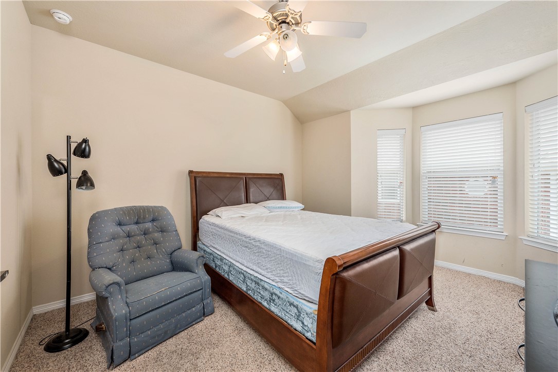 1198 Jones-Butler Road, Unit 2201 College Station, TX 77840 - Photo 6 of 8 a bedroom with a bed and a couch