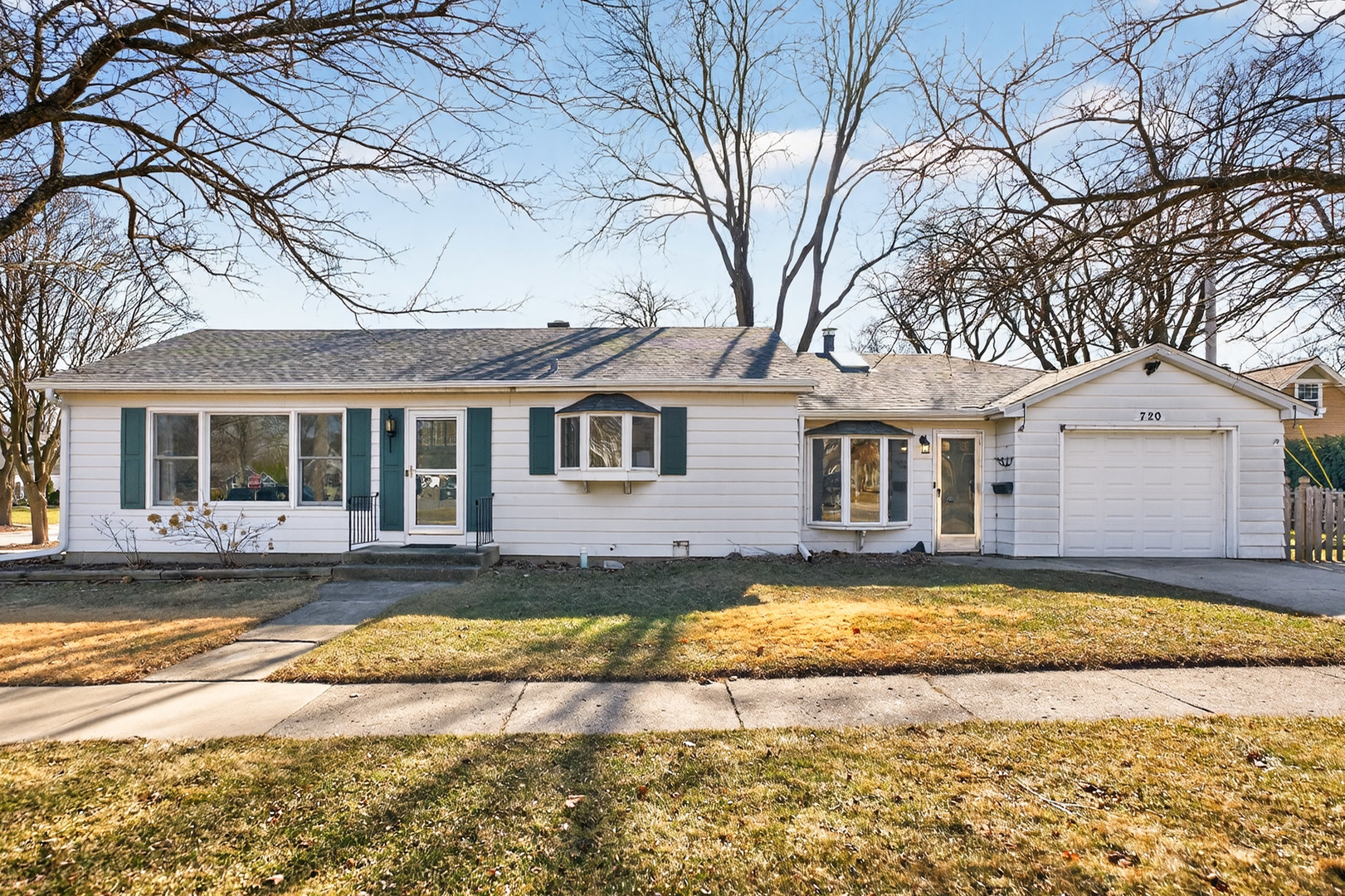 720 East Harrison Avenue Wheaton, IL 60187 - Photo 1 of 28 a view of a house with a yard covered with snow in front of house