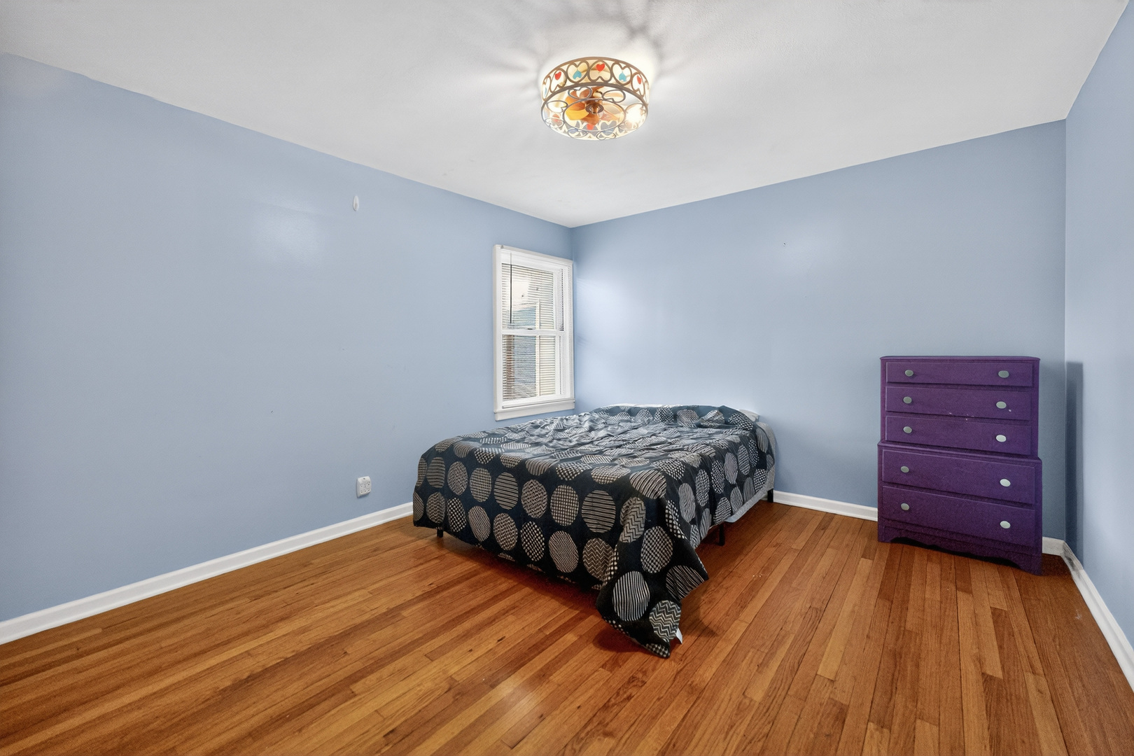720 East Harrison Avenue Wheaton, IL 60187 - Photo 12 of 28 a bedroom with a bed and a table