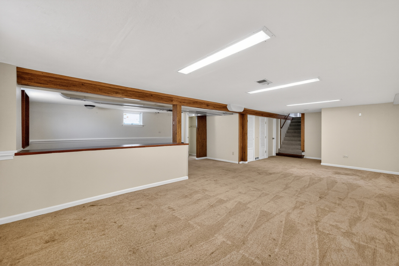 720 East Harrison Avenue Wheaton, IL 60187 - Photo 18 of 28 a view of an empty room with wooden floor and windows