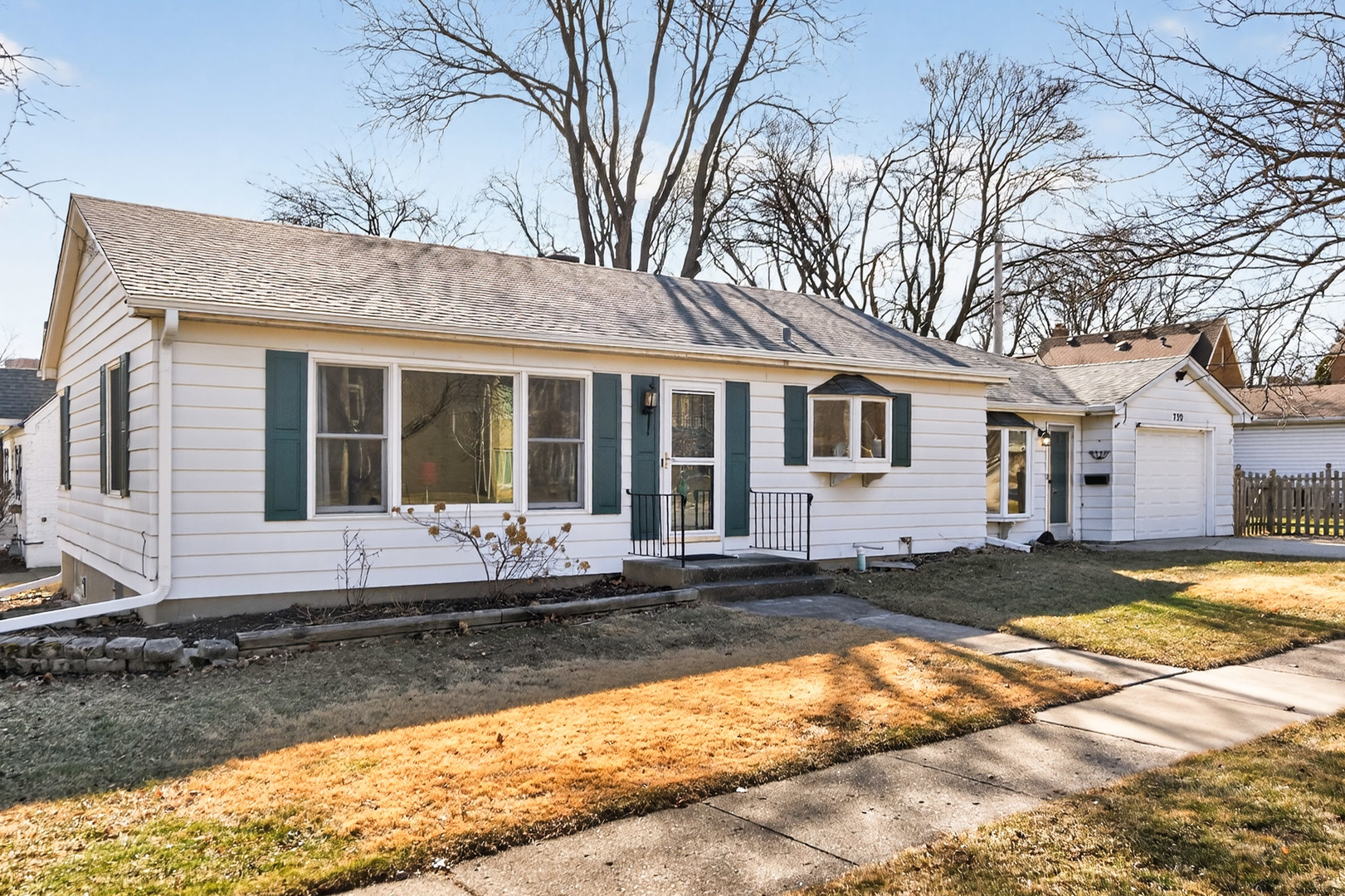 720 East Harrison Avenue Wheaton, IL 60187 - Photo 2 of 28 a front view of a house with a yard
