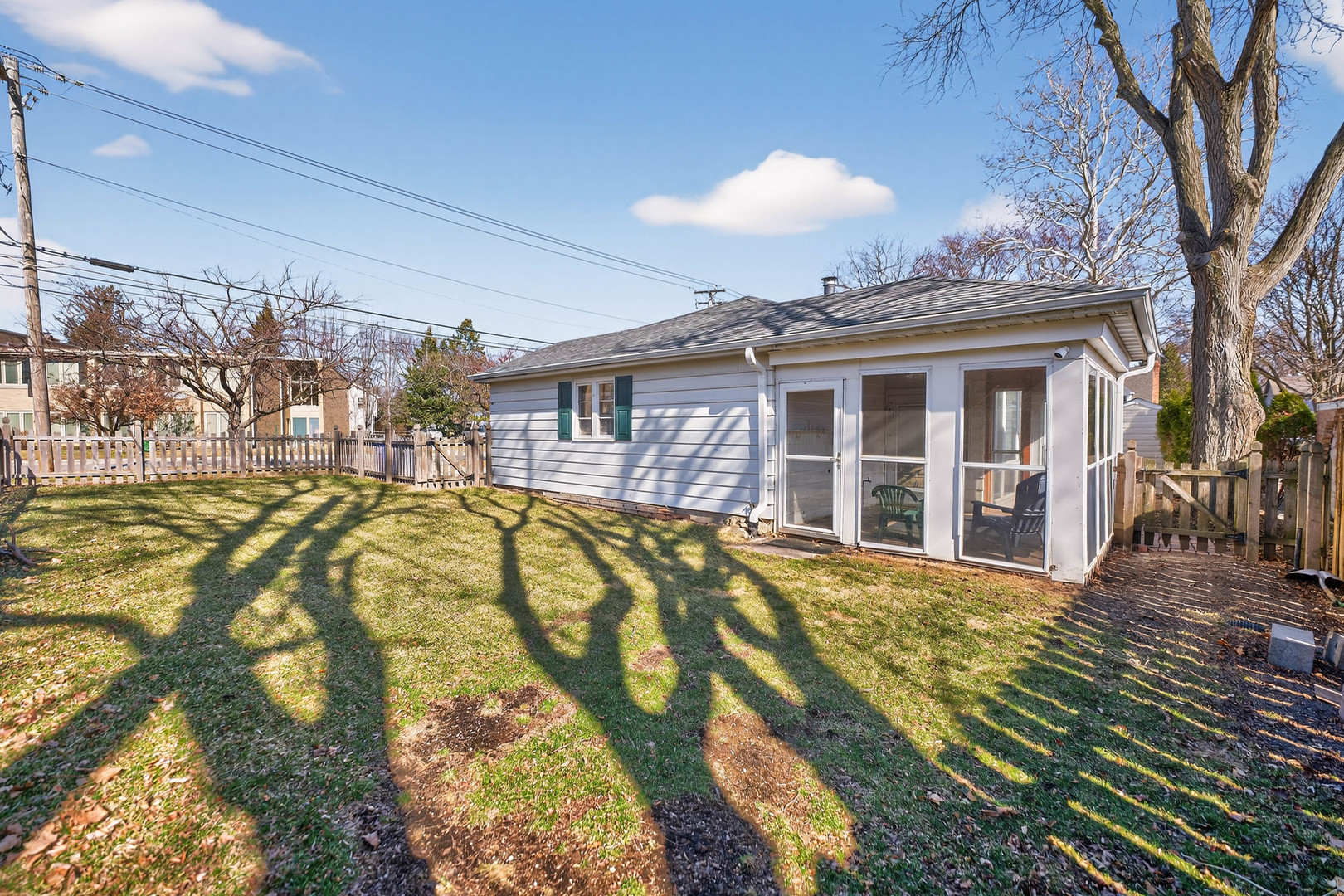 720 East Harrison Avenue Wheaton, IL 60187 - Photo 26 of 28 a view of a house with a large window and a yard