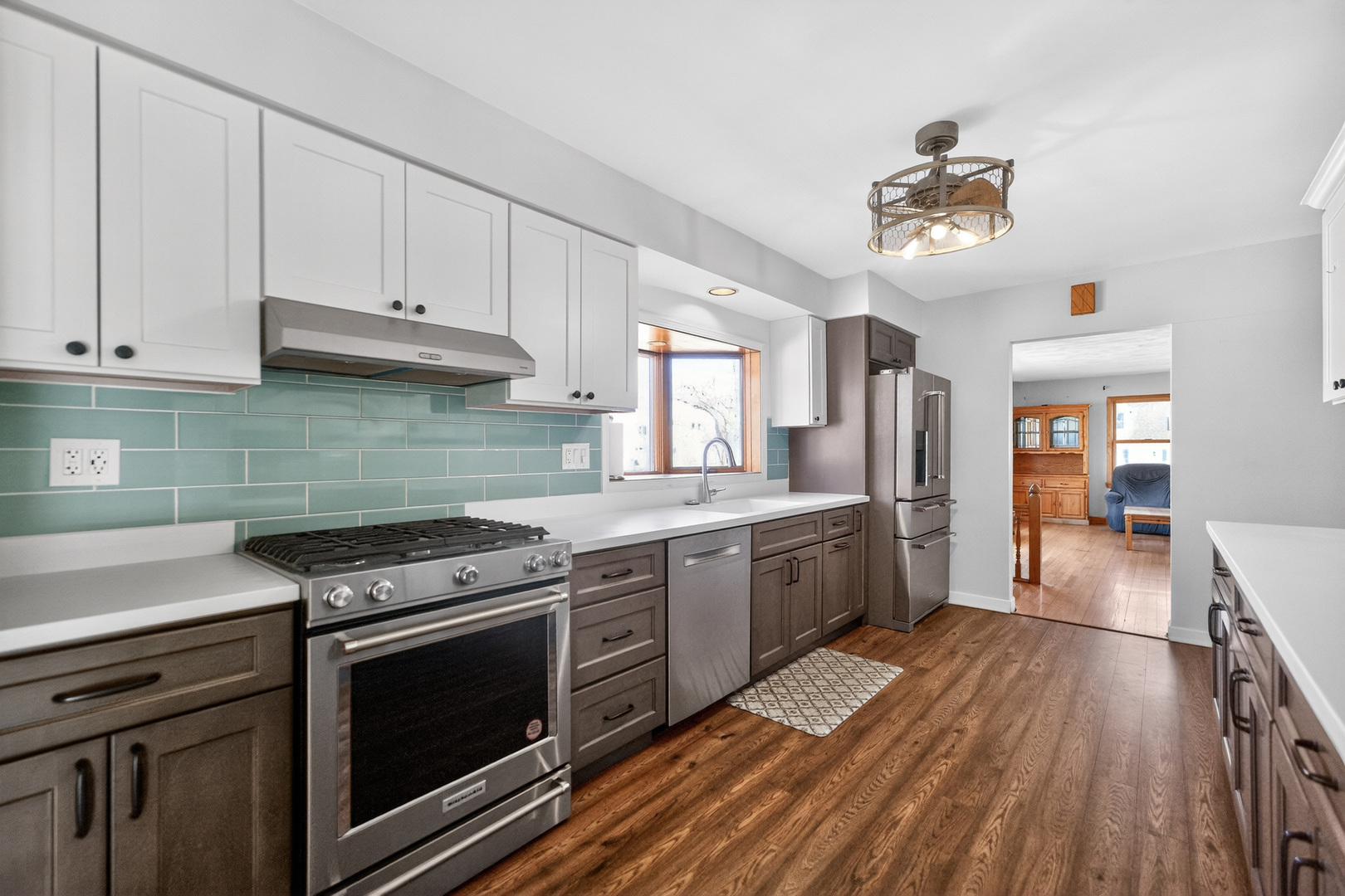 720 East Harrison Avenue Wheaton, IL 60187 - Photo 7 of 28 a kitchen with granite countertop a stove top oven and cabinets