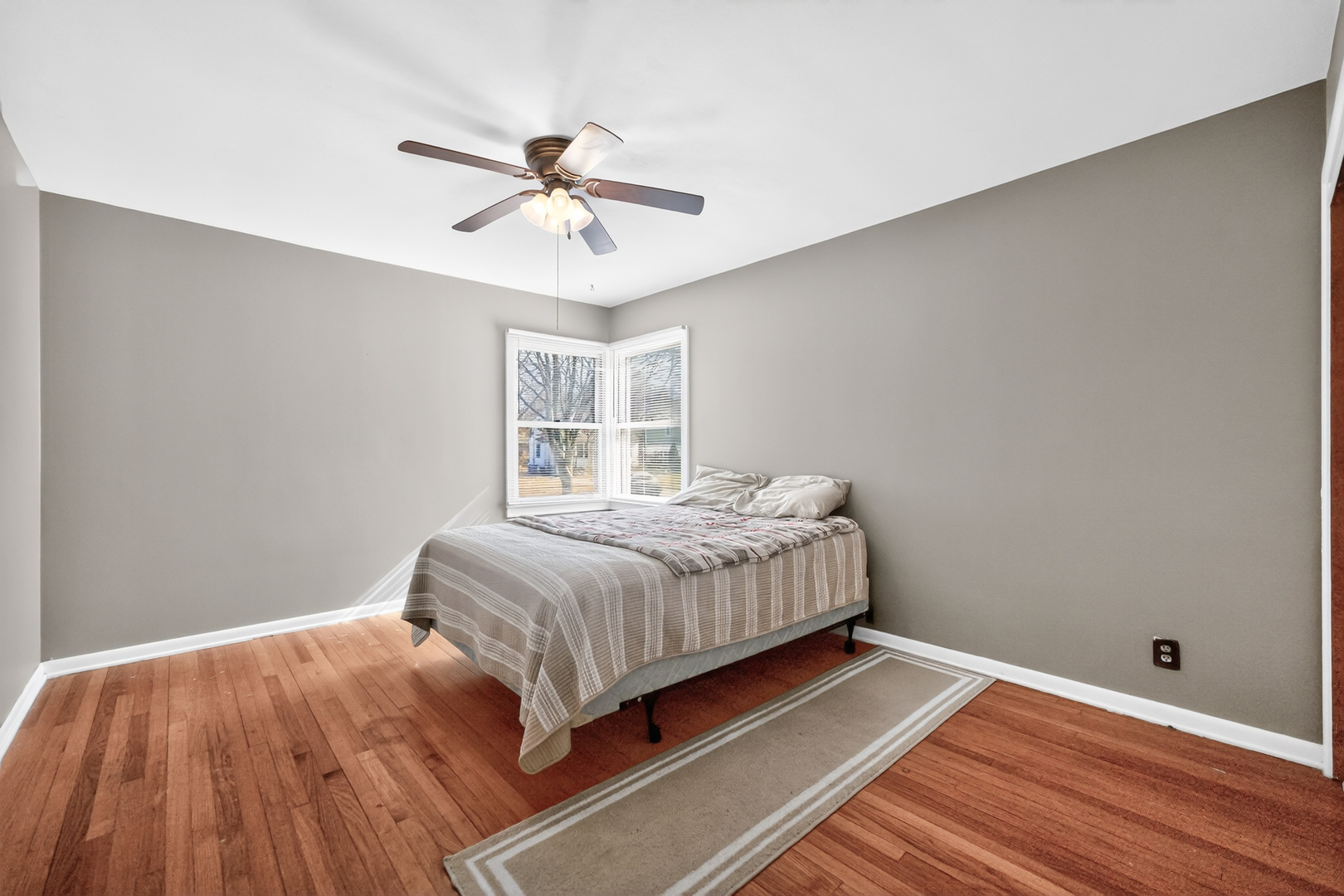 720 East Harrison Avenue Wheaton, IL 60187 - Photo 10 of 28 a bedroom with a bed and a window