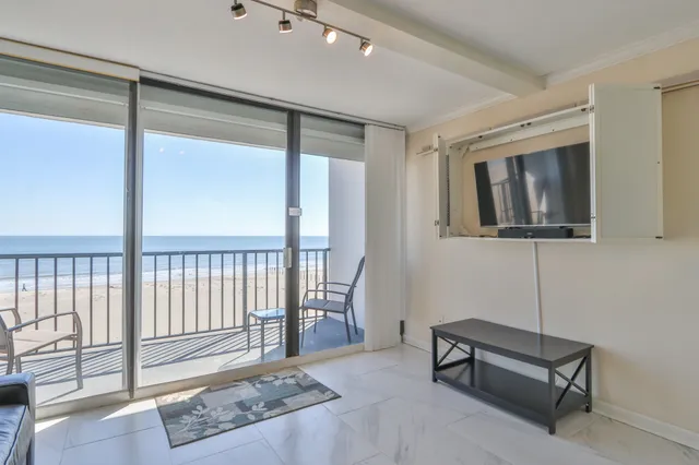a balcony with wooden floor and fence
