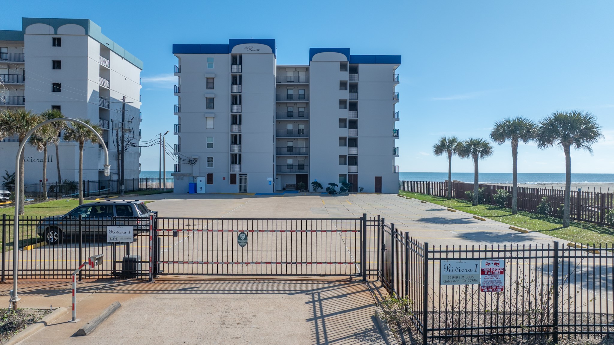 11949 Termini-San Luis Pass Road, Unit 304 Galveston, TX 77554 - Photo 2 of 39 The parking area offers private coded gates for your security