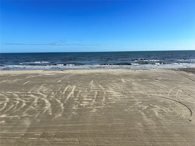 a view of a kitchen with a sink and a stove top oven