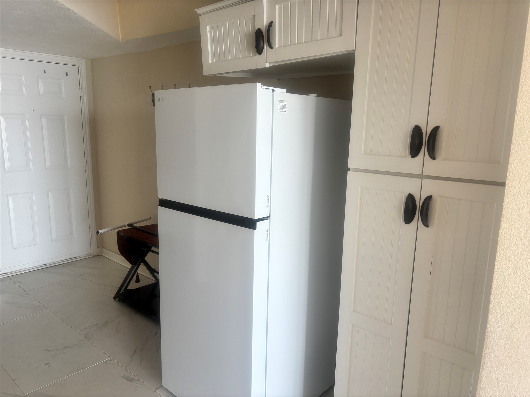 11949 Termini-San Luis Pass Road, Unit 304 Galveston, TX 77554 - Photo 8 of 39 The fridge and pantry are just off of the kitchen