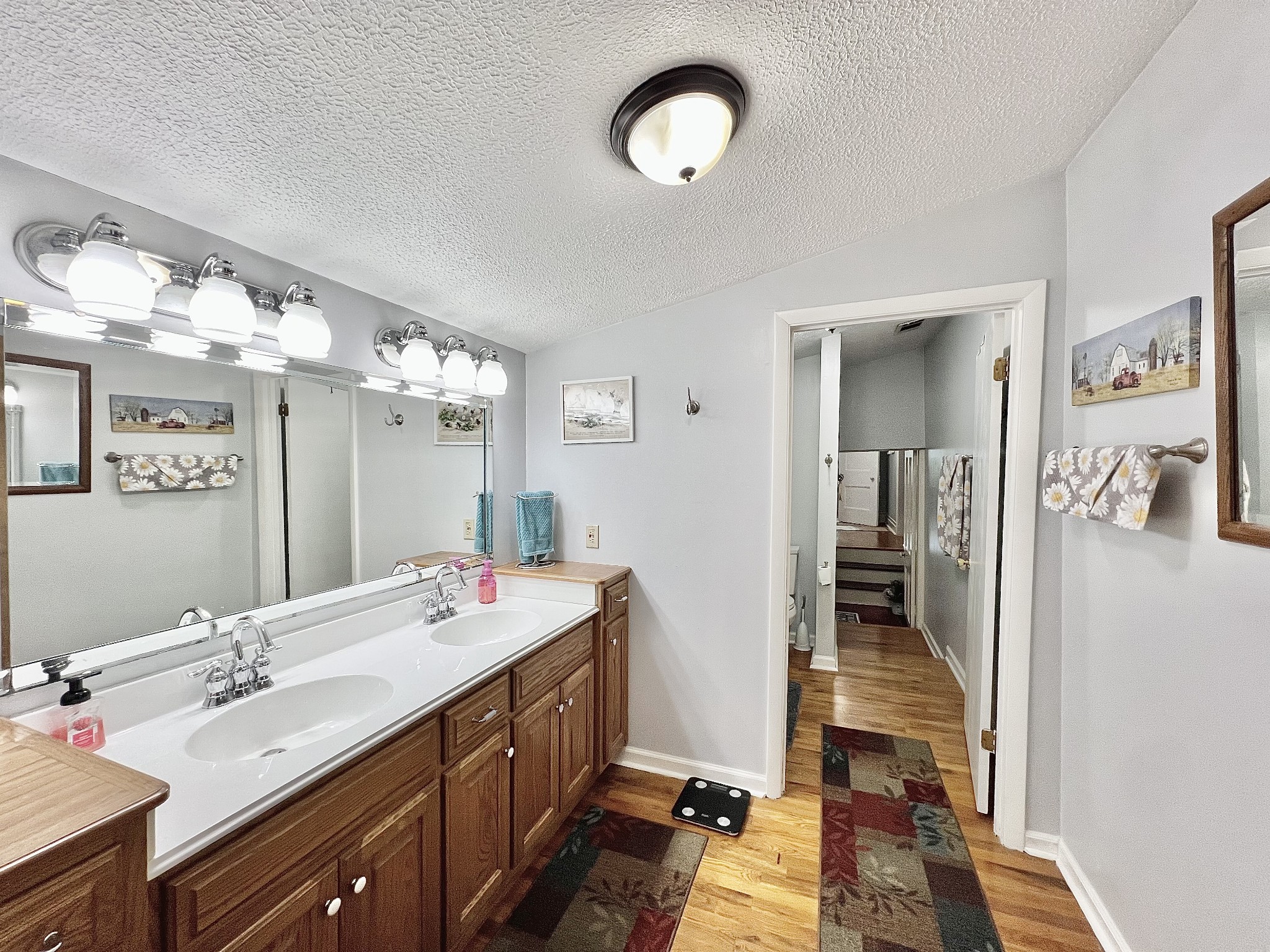 1400 Ragsdale Lane Pulaski, TN 38478 - Photo 56 of 100 a spacious bathroom with a double vanity sink a mirror and a shower