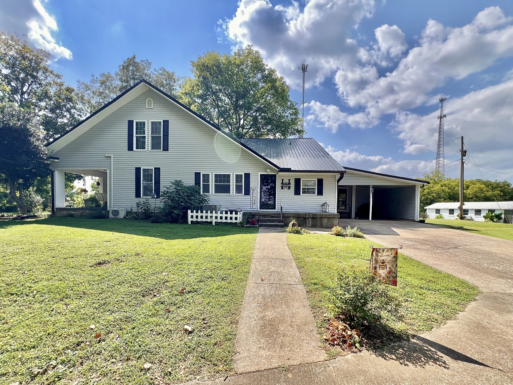 1400 Ragsdale Lane Pulaski, TN 38478 - Photo 61 of 100 a front view of a house with a yard table and chairs