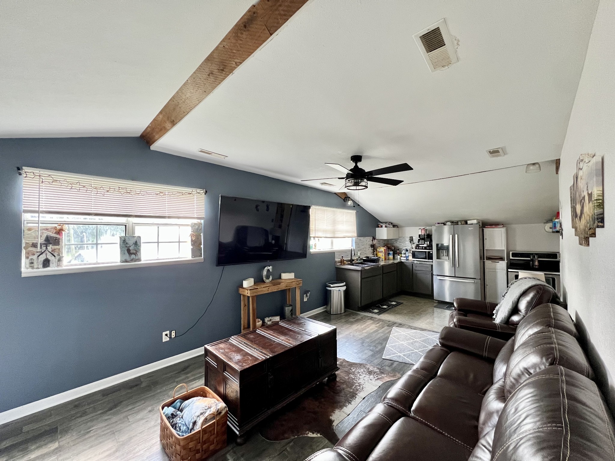 1400 Ragsdale Lane Pulaski, TN 38478 - Photo 72 of 100 a living room with furniture a flat screen tv and kitchen view