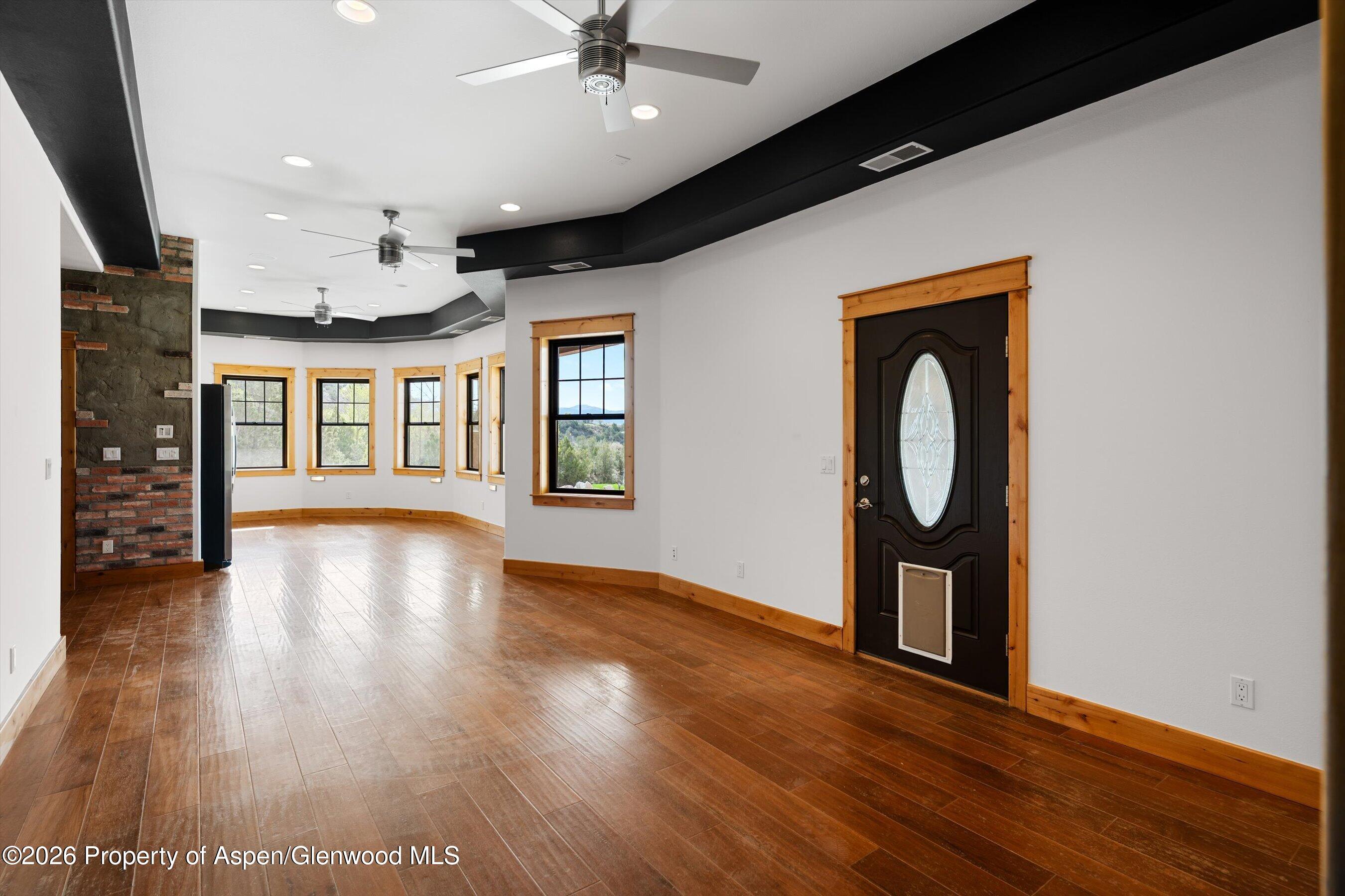 450 Summer Falls Road Silt, CO 81652 - Photo 22 of 50 a view of livingroom with hardwood floor and a ceiling fan