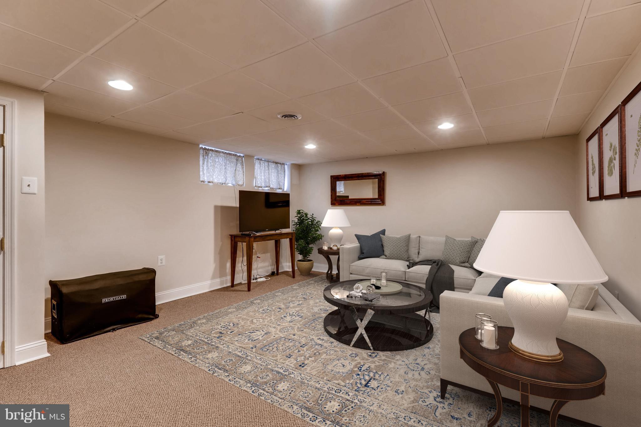 427 Stratford Road Baltimore, MD 21228 - Photo 24 of 29 a living room with furniture and a flat screen tv