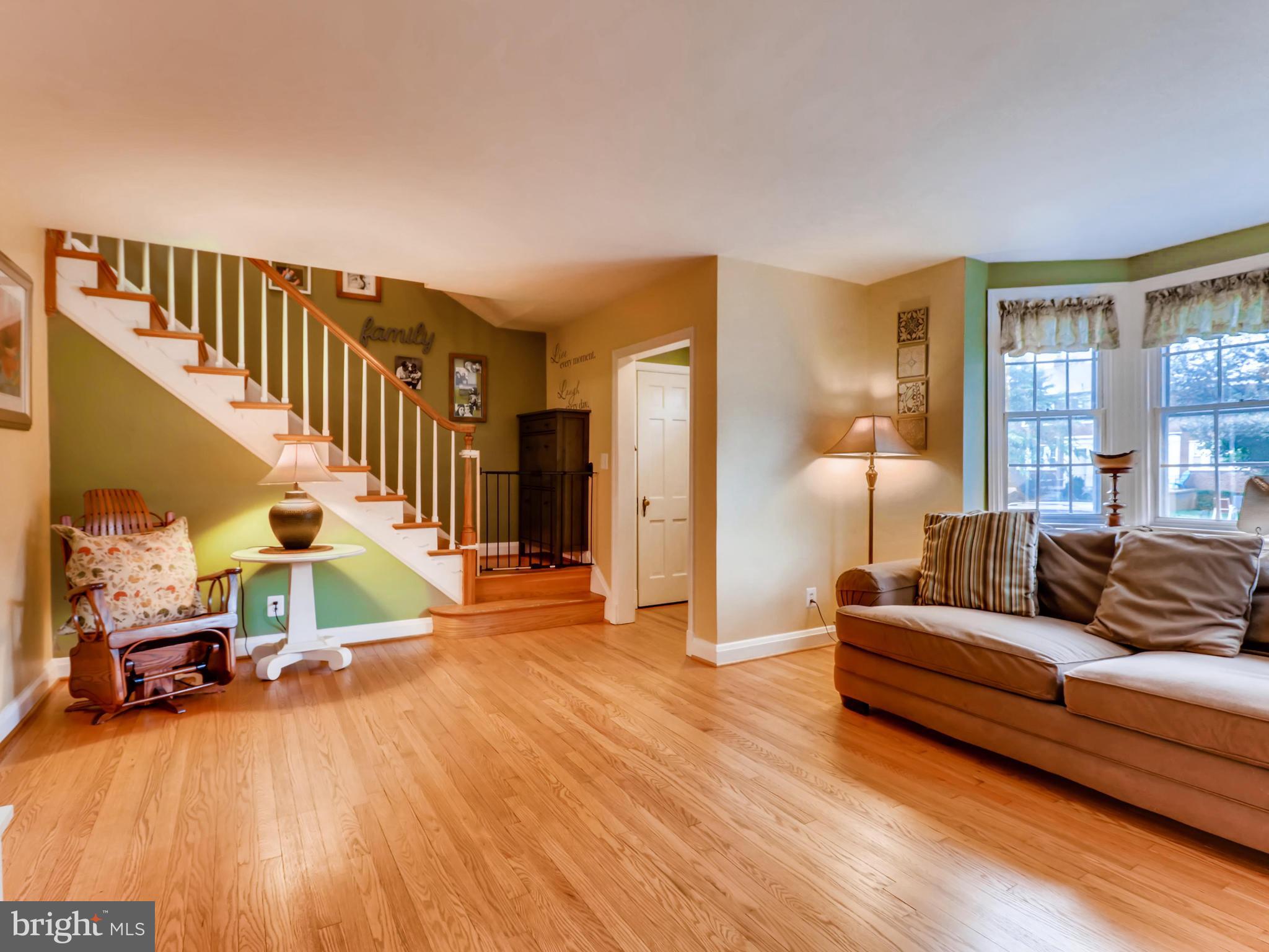 427 Stratford Road Baltimore, MD 21228 - Photo 5 of 29 a living room with furniture and a wooden floor