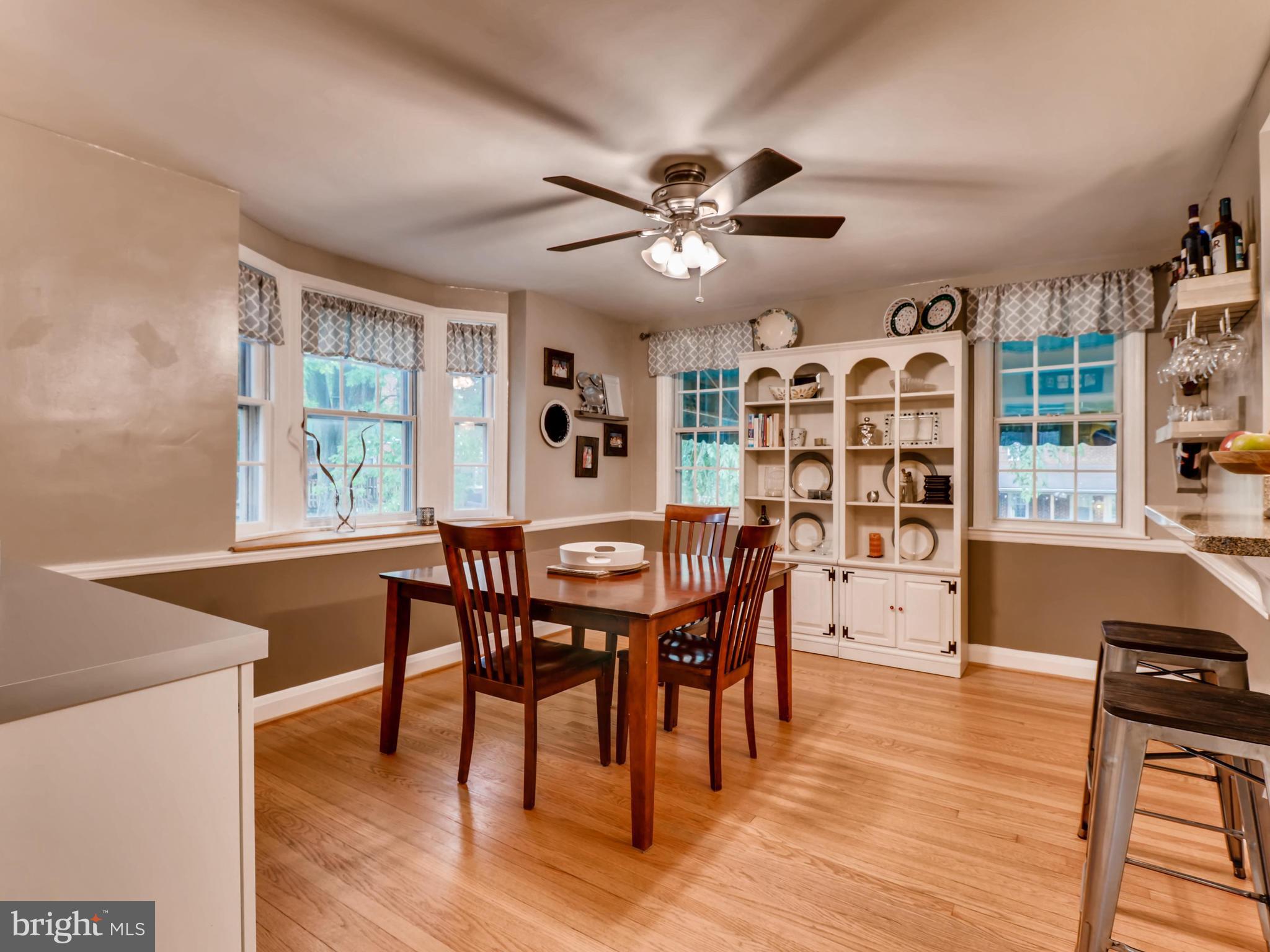 427 Stratford Road Baltimore, MD 21228 - Photo 8 of 29 a view of a dining room with furniture window and wooden floor