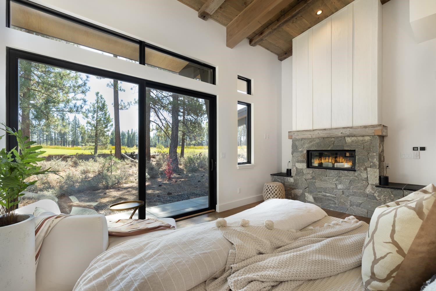 11654 Henness Road Truckee, CA 96161 - Photo 15 of 21 a bedroom with furniture and a fireplace