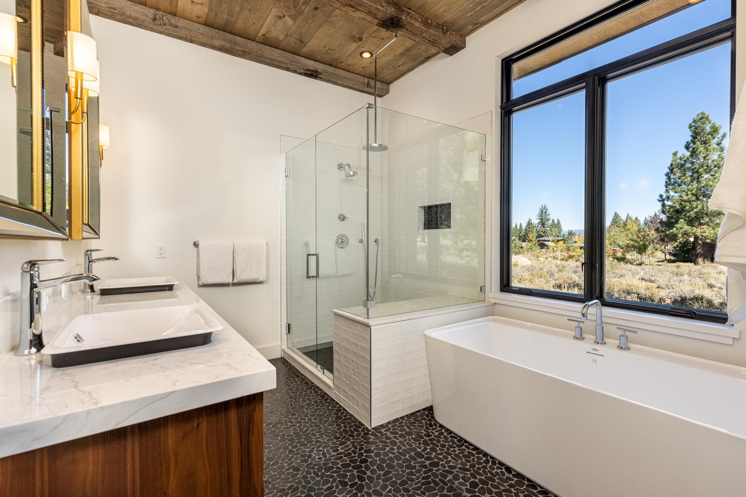 11654 Henness Road Truckee, CA 96161 - Photo 16 of 21 a bathroom with a tub sink and mirror