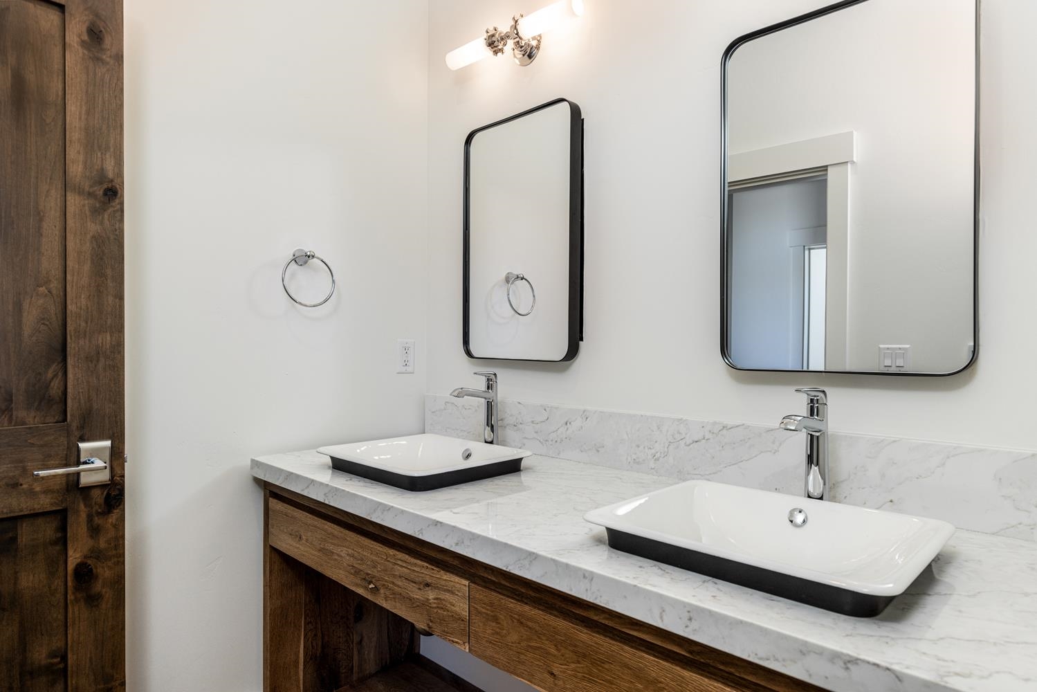 11654 Henness Road Truckee, CA 96161 - Photo 20 of 21 a bathroom with double vanity sinks and a mirror